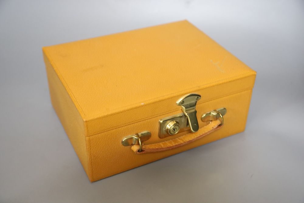 A 1960s plastic black and cream clutch bag, a black velvet bag and cream bag with Bakelite frame and a leather travel case
